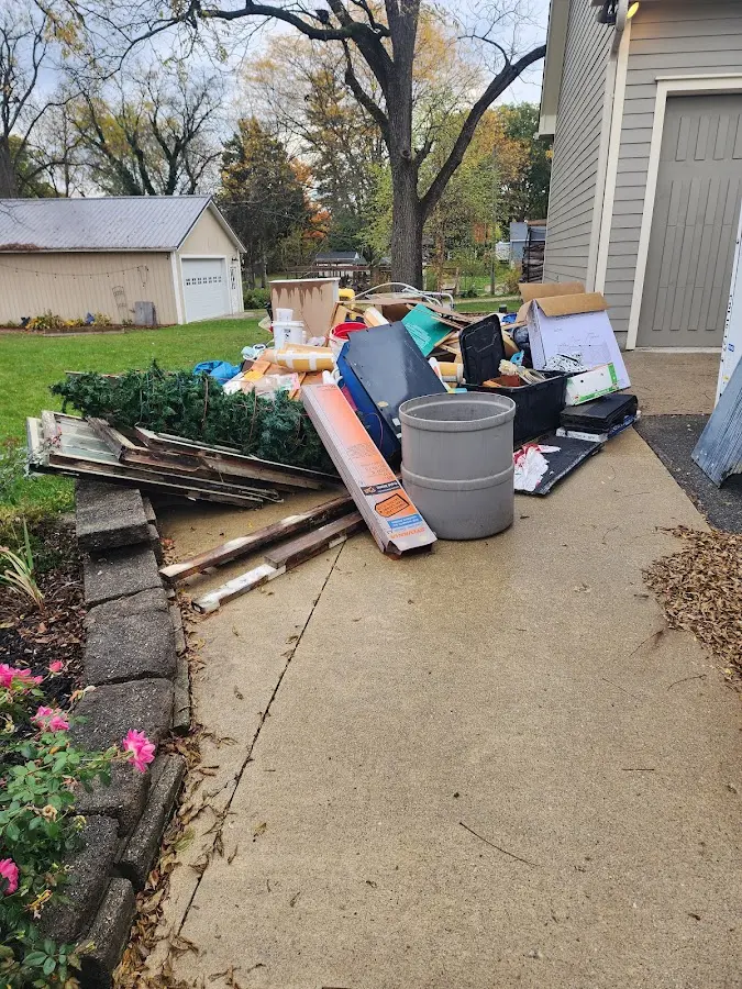 Dumpster being loaded with debris for Demolition Dumpster Rental in Colchester